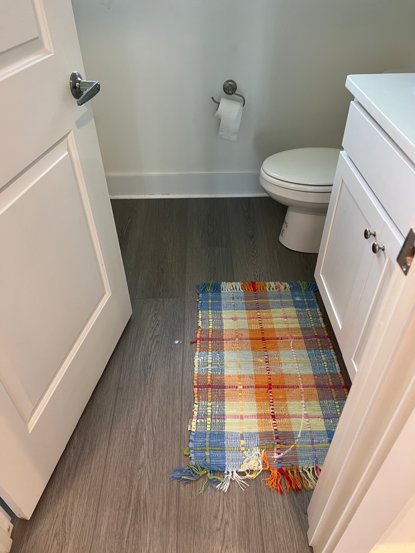 Elegant beach-themed bathroom Flooring Installation with waterproof vinyl in Pensacola