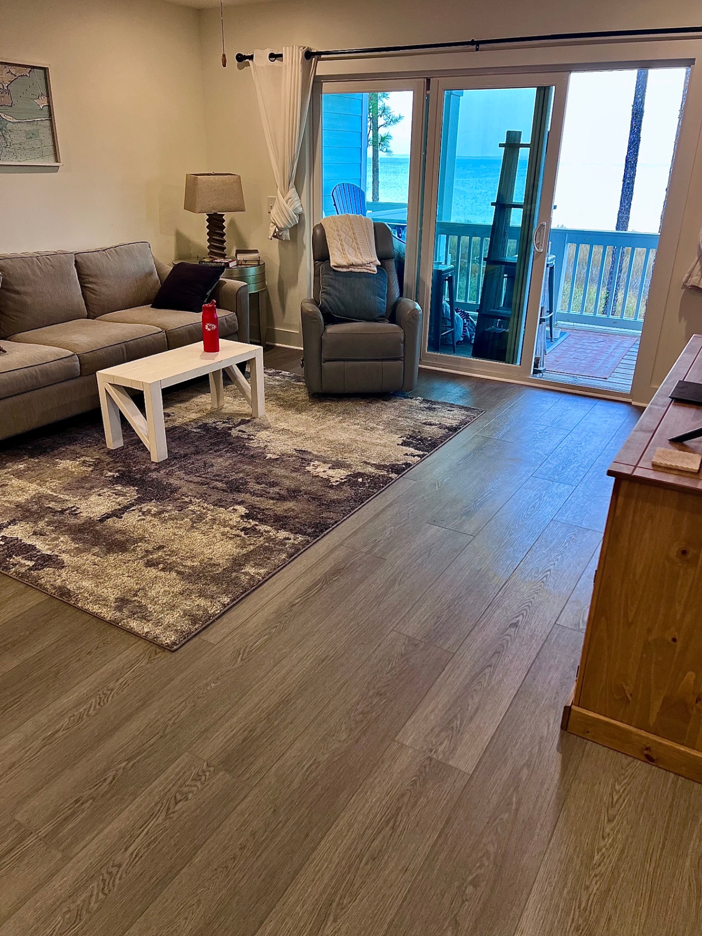 Modern beach condo vinyl flooring with light-toned luxury vinyl in Brent