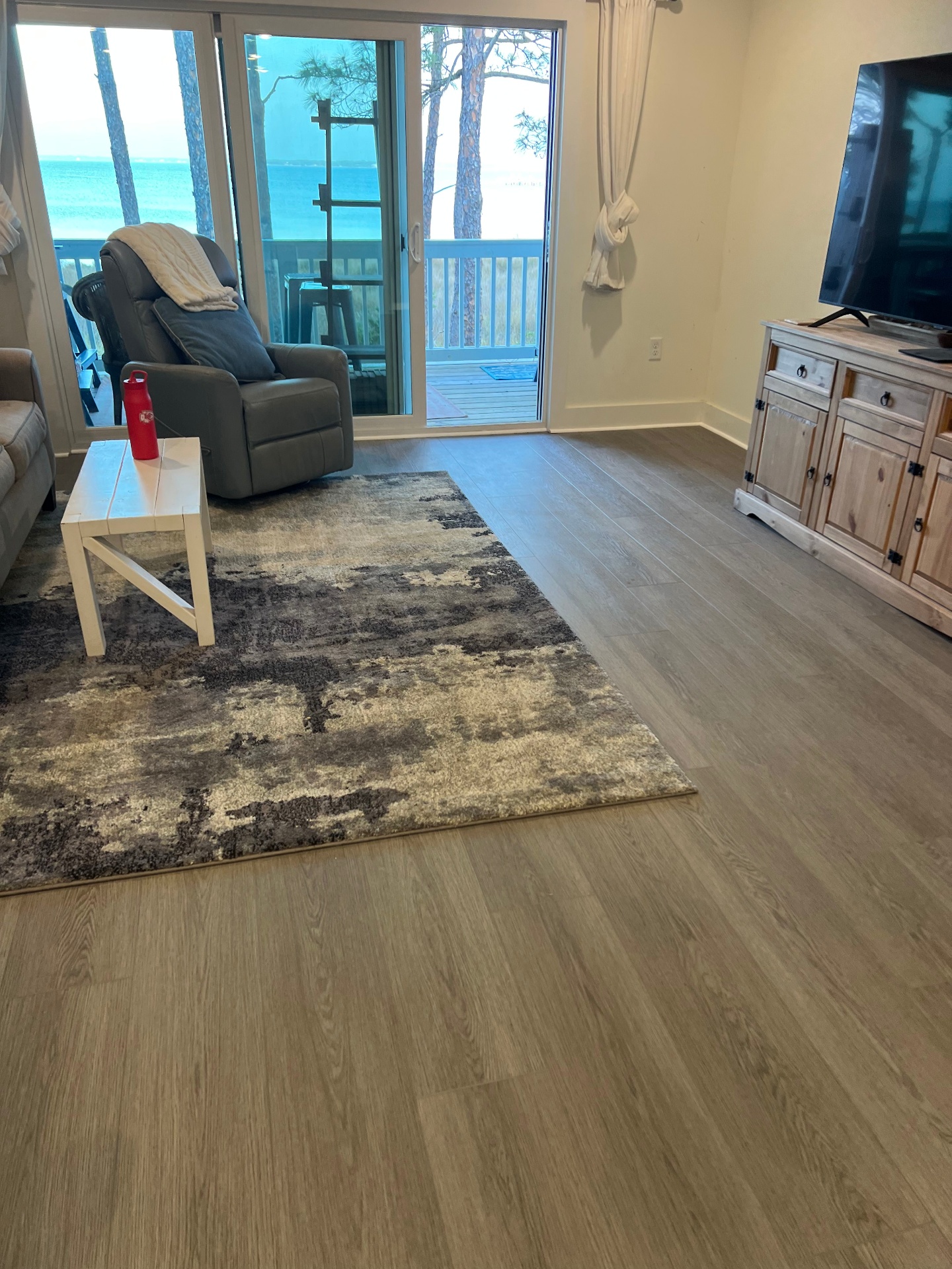 Stunning oceanview living room vinyl flooring with luxury vinyl plank flooring in Brent