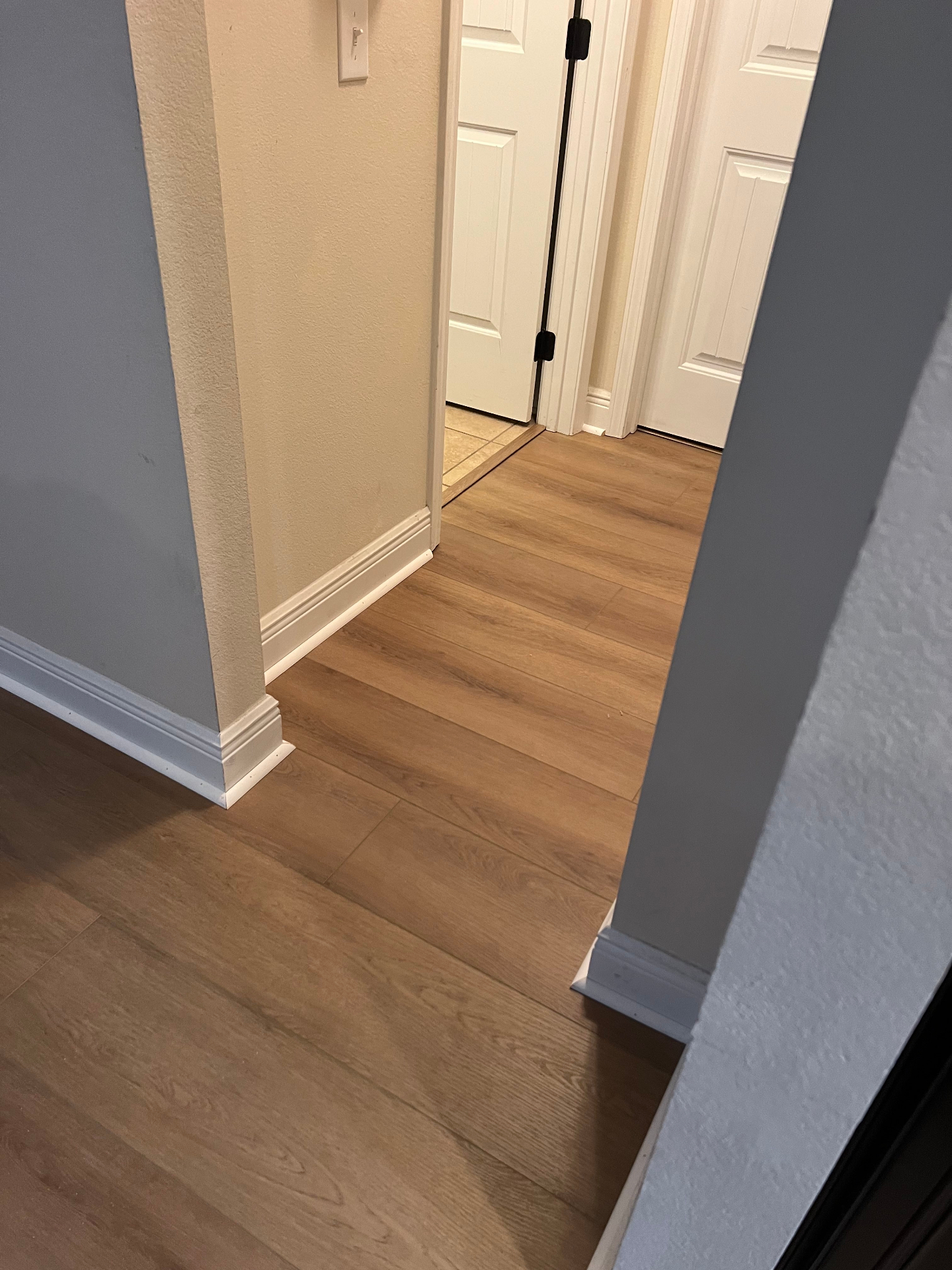 Long hallway Flooring Installation with consistent vinyl plank installation in Pensacola