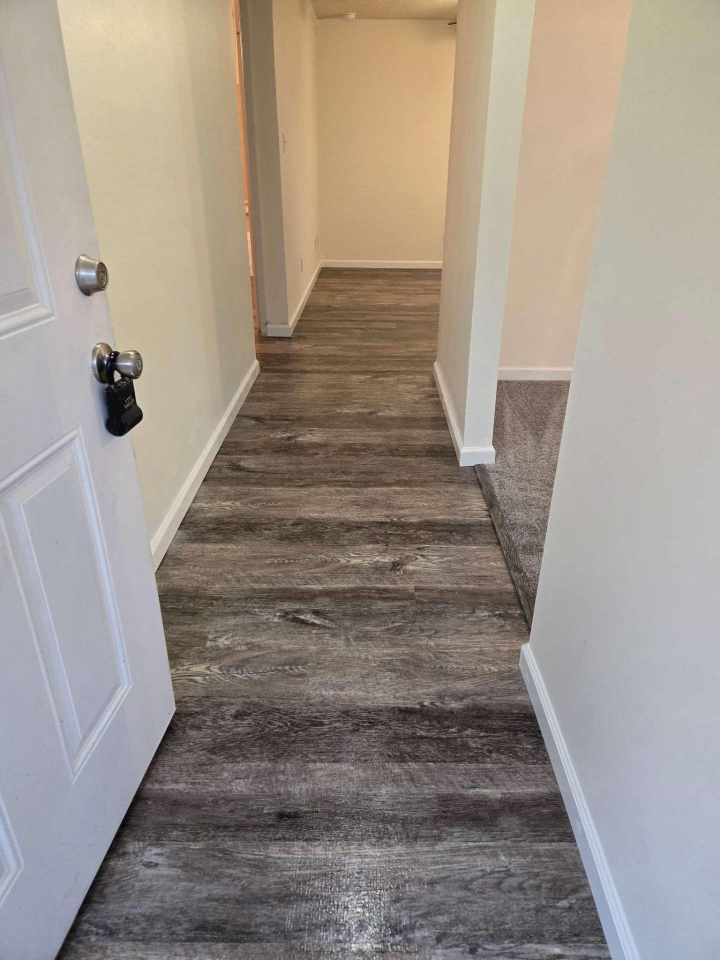 Vinyl Flooring Installation with seamless room transition in Pensacola