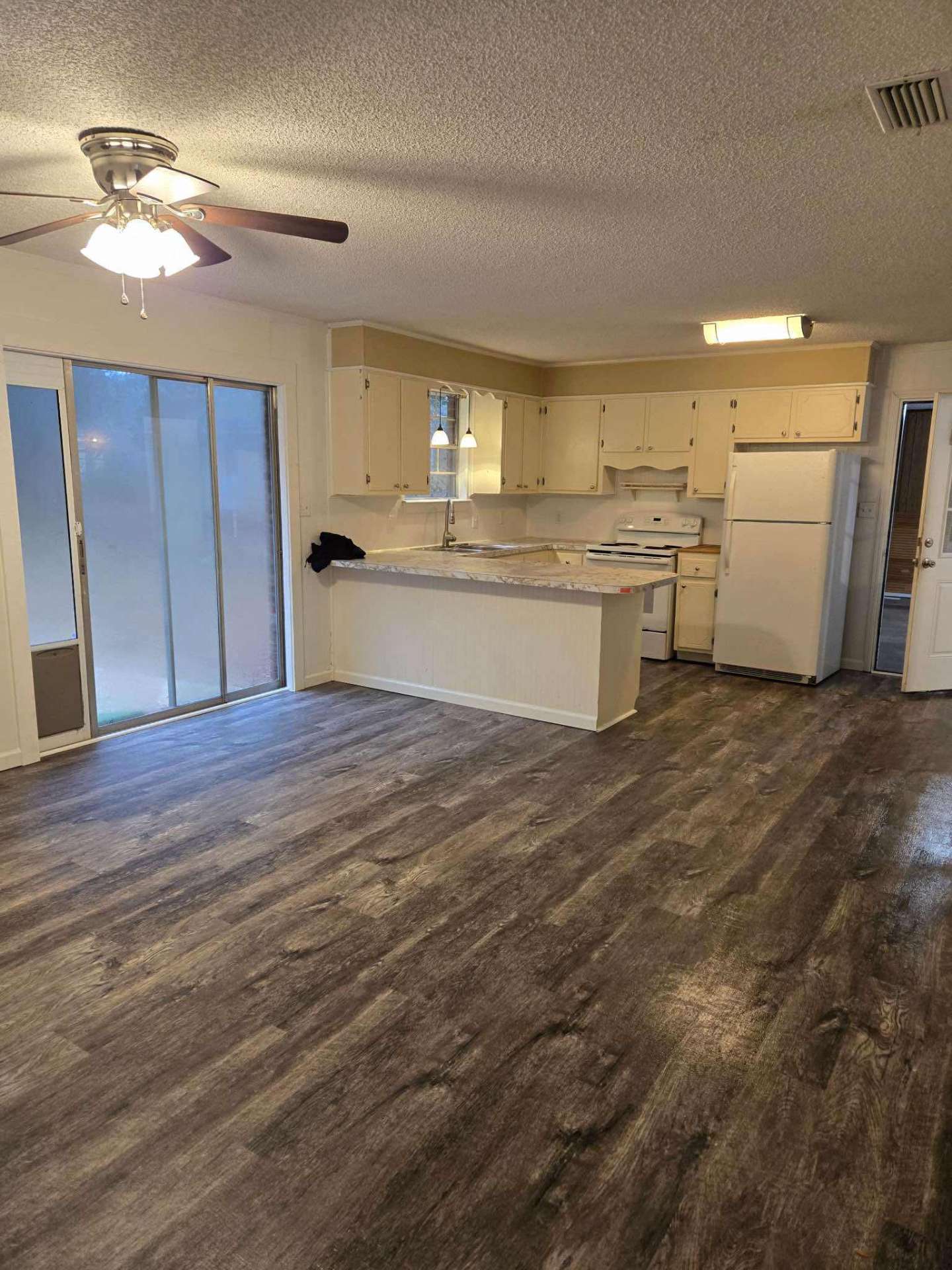 Updated kitchen vinyl flooring with luxury vinyl planks in Brent